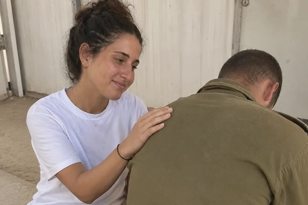 A reservist sitting across from a therapist